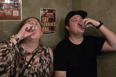 Levi & Anna doing shots of the snake liquor