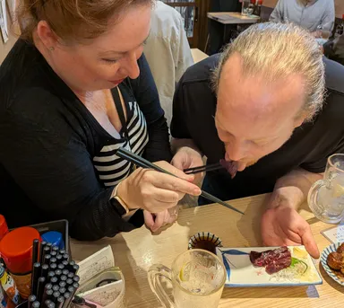 Anna & James trying whale sashimi